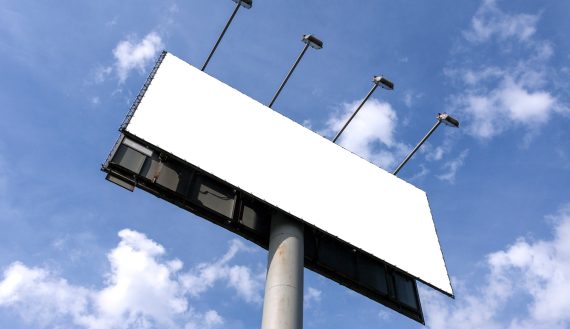 Outdoor billboard against blue sky